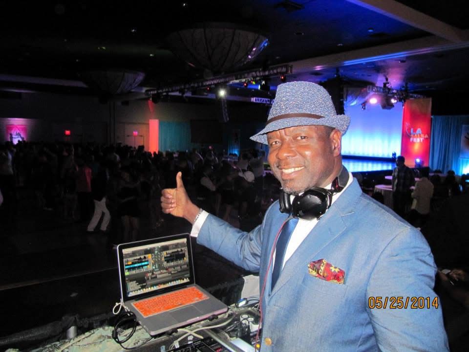 Dr. Salsa beside his DJ equipment at the 2014 Los Angeles Salsa Fest.
