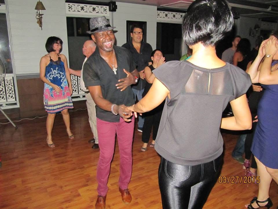 Dr. Salsa dancing with a partner during the SALSA CONCEPT® Asia tour evening in Bangkok.
